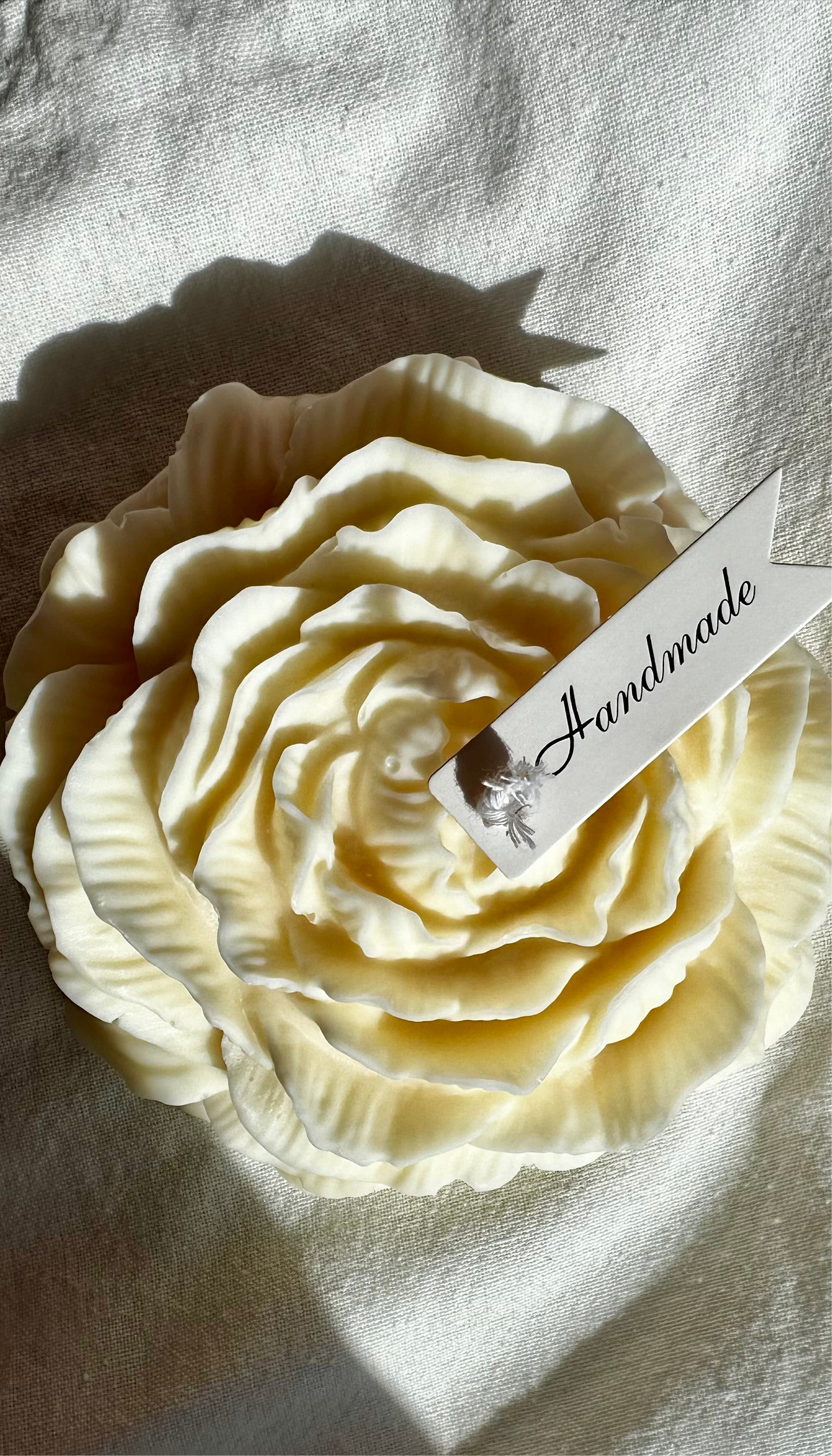 Peony Sculptural Candle Unscented | Natural Soy Wax on a linen with sun shadows