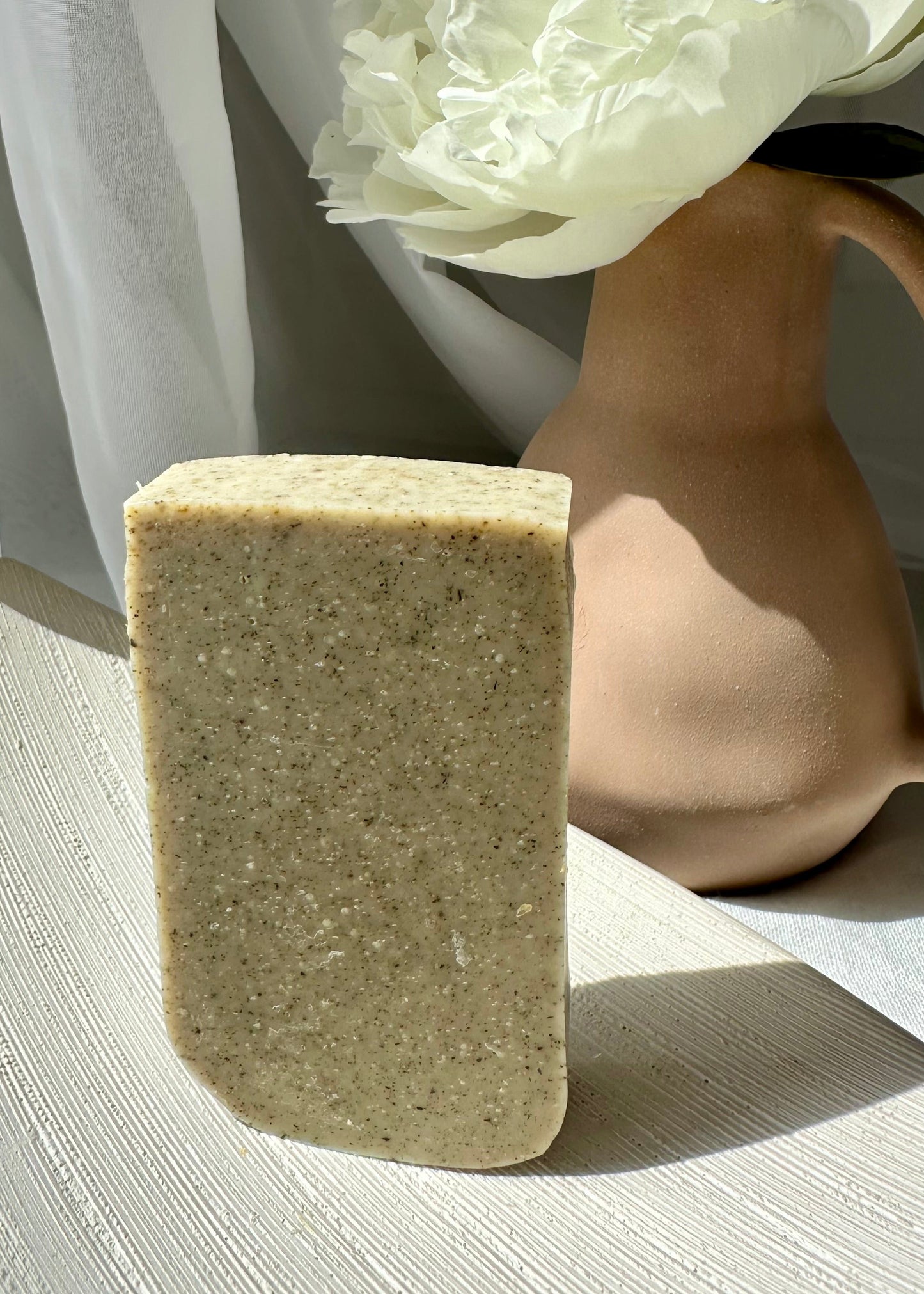Handcrafted vegan soap bar infused with rosemary infusion oil and peppermint.