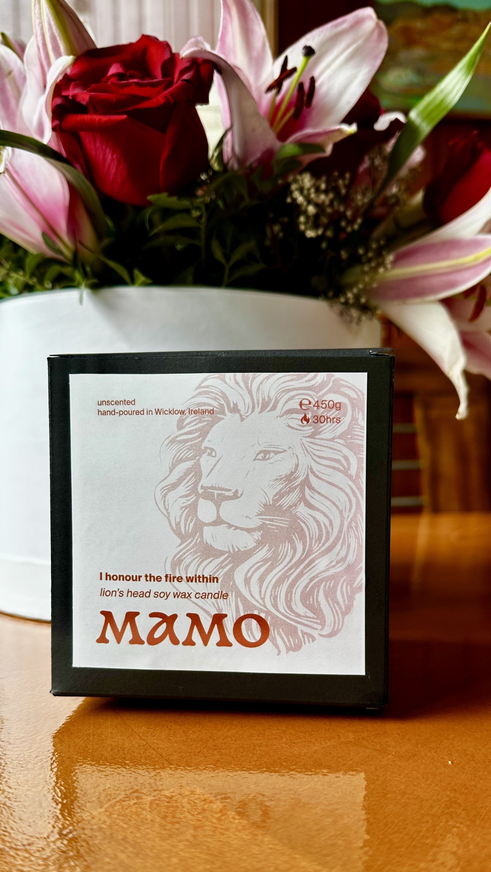 Black Box with red label packaged lions head candle gift ready