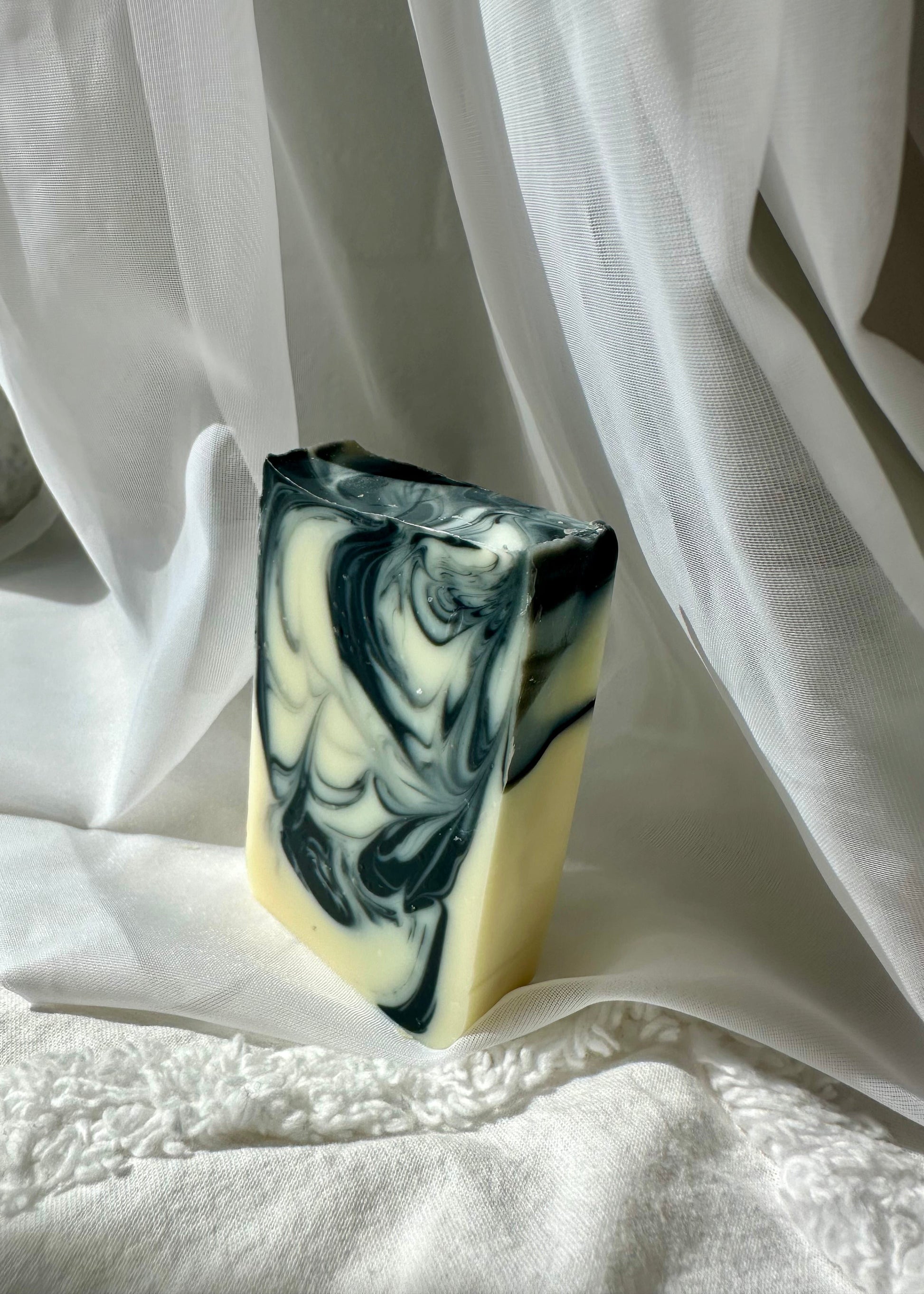 Detoxifying charcoal soap bar with kaolin clay by MAMO on cotton