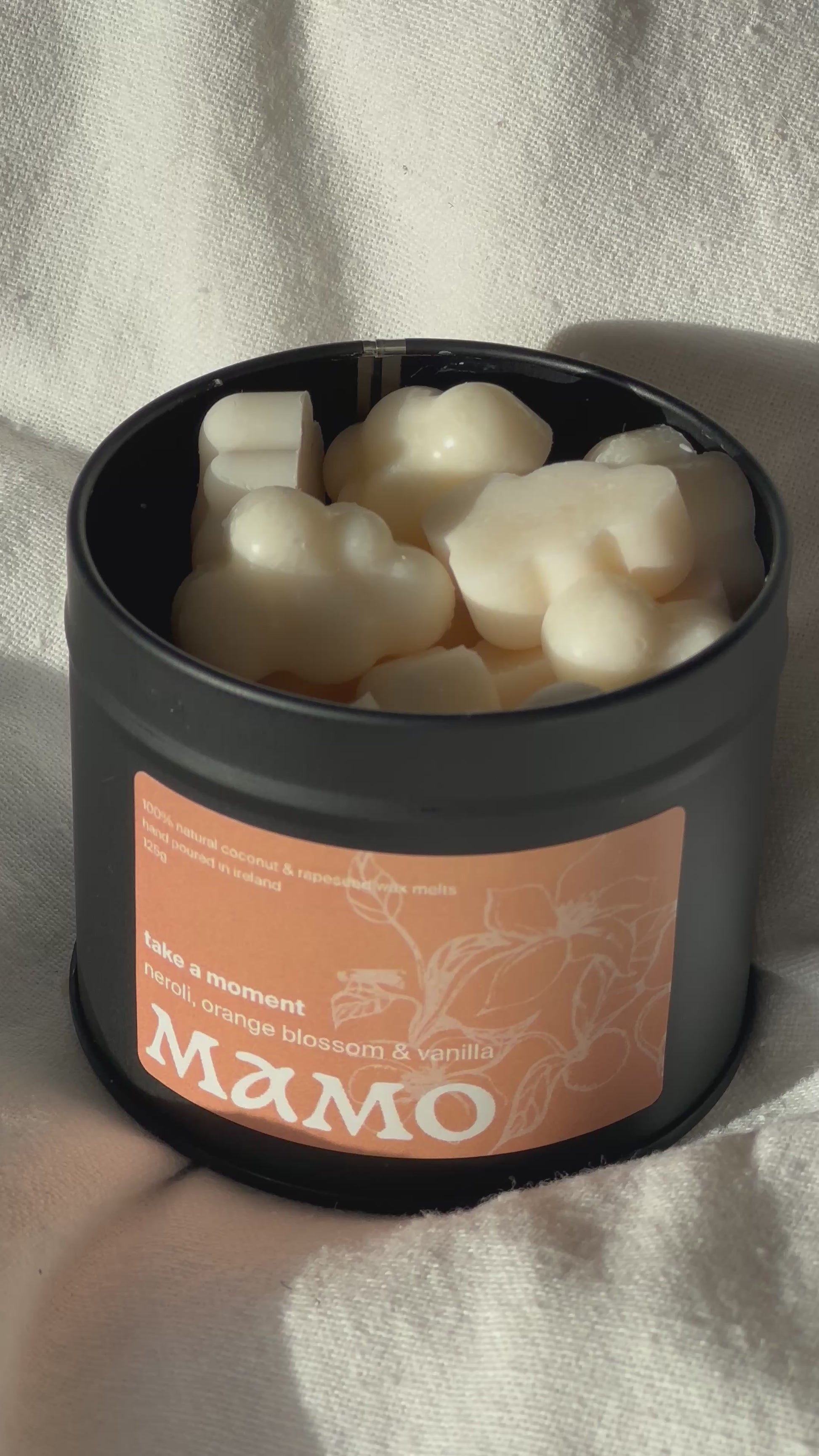 MAMO “Take A Moment” wax melts in soft matte tin on linen cloth - tin open clouds visible
