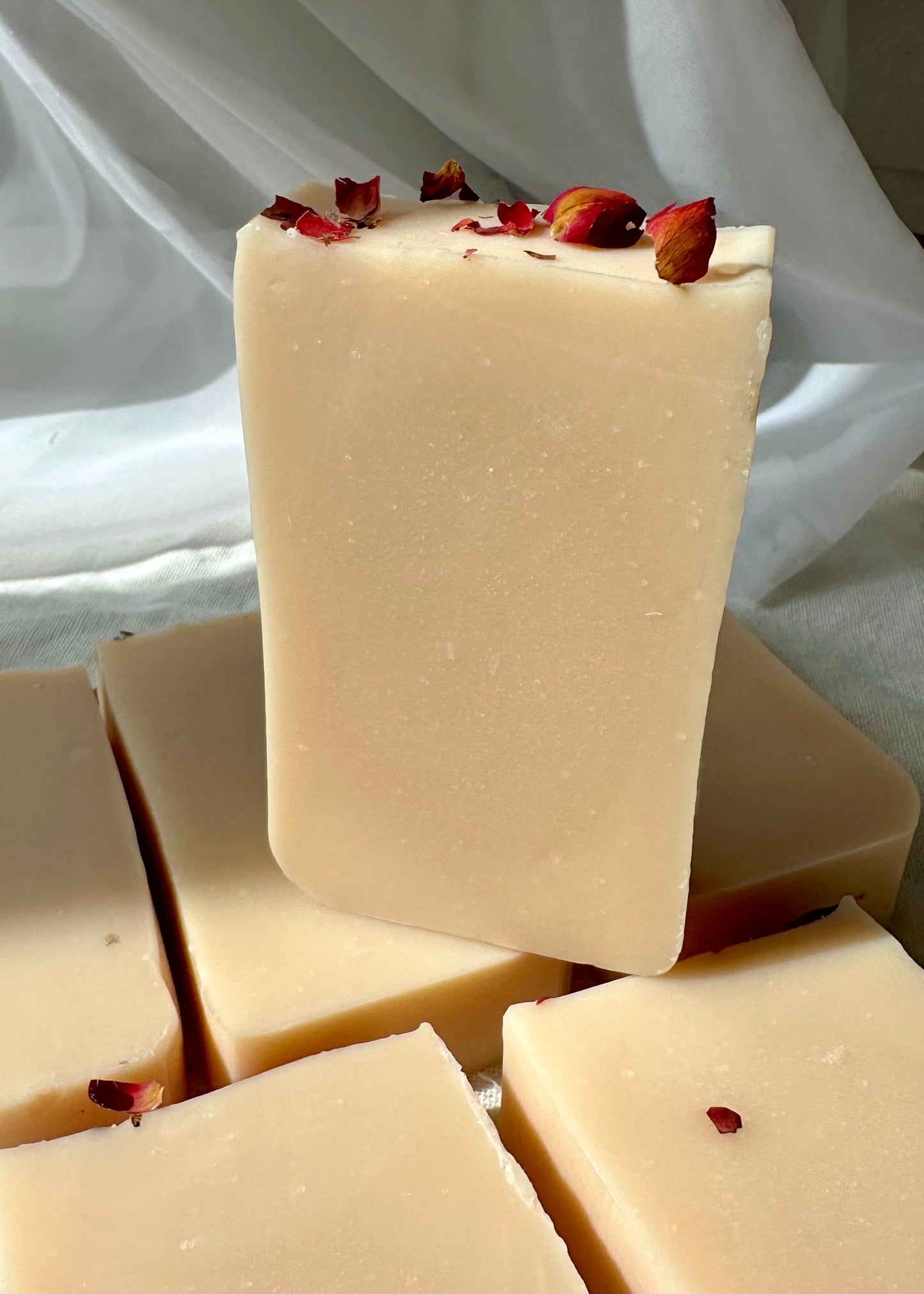 Pink  Botanical body soap with rose petals and grapefruit essential oil close up