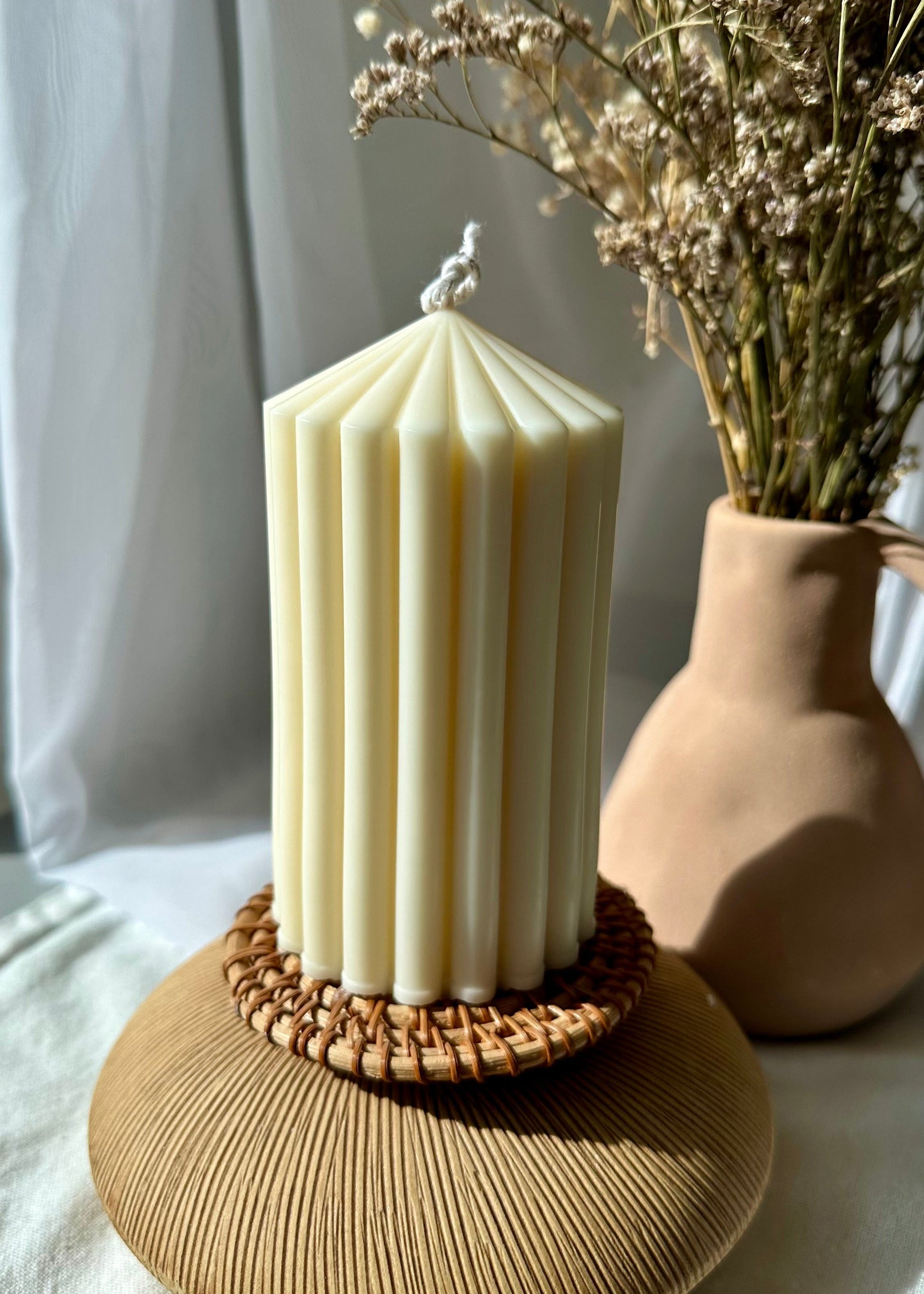 Ribbed Soy Pillar candle on a stand